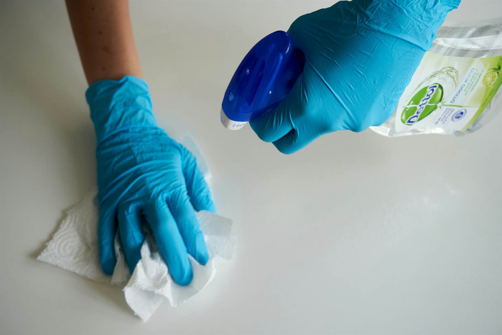 Scrubbing a benchtop by hand